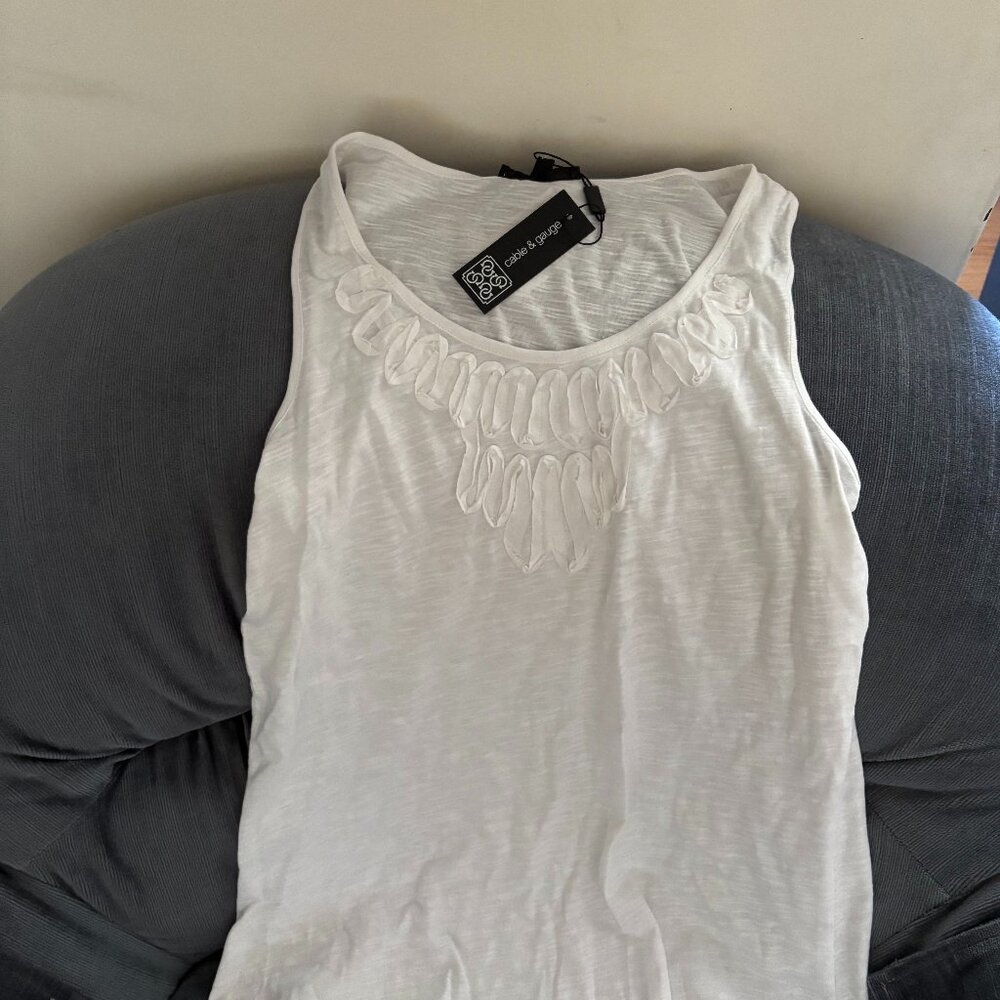 White sleeveless top with decorative front